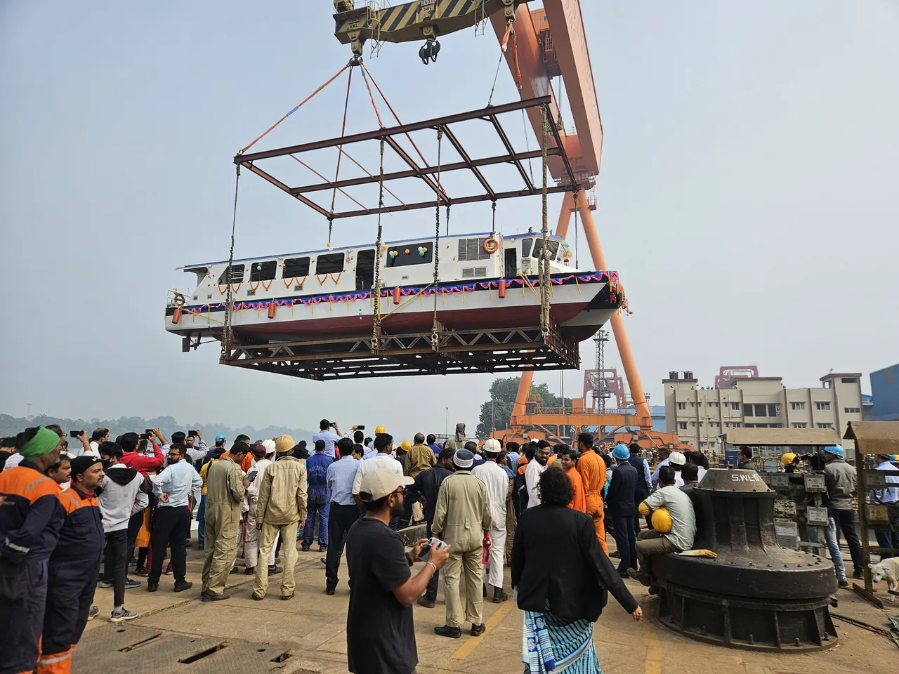 Next-generation solar-electric ferry during crane launch.