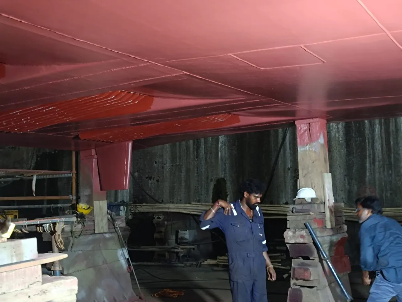 Underwater-hull preparation and coating work during the INS Kalpeni refit.