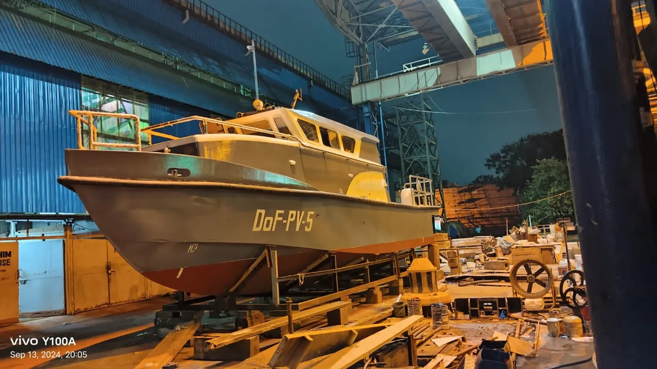 FRP patrol boat under construction in the workshop.