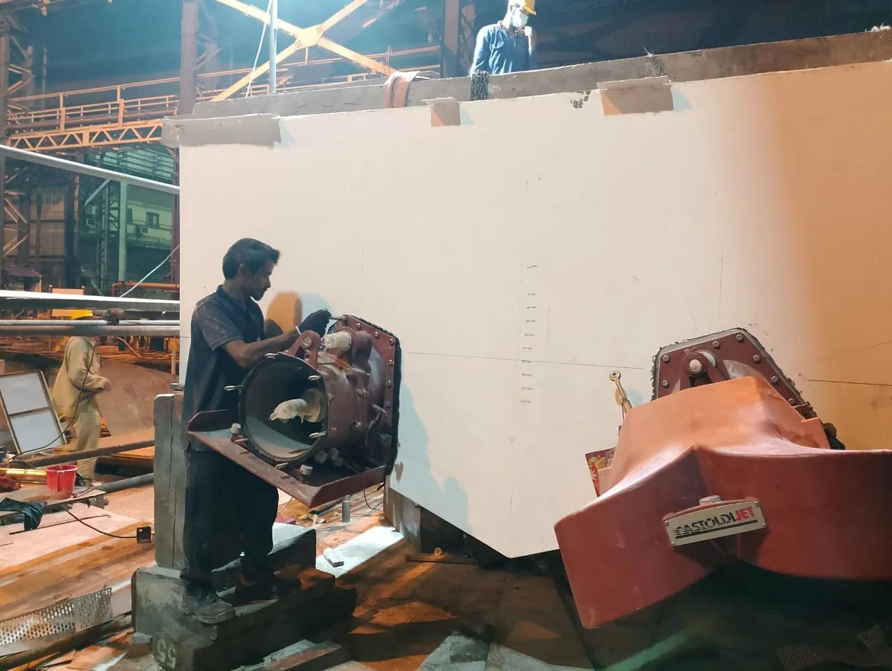 Propulsion-area outfitting during construction of an FRP patrol boat.